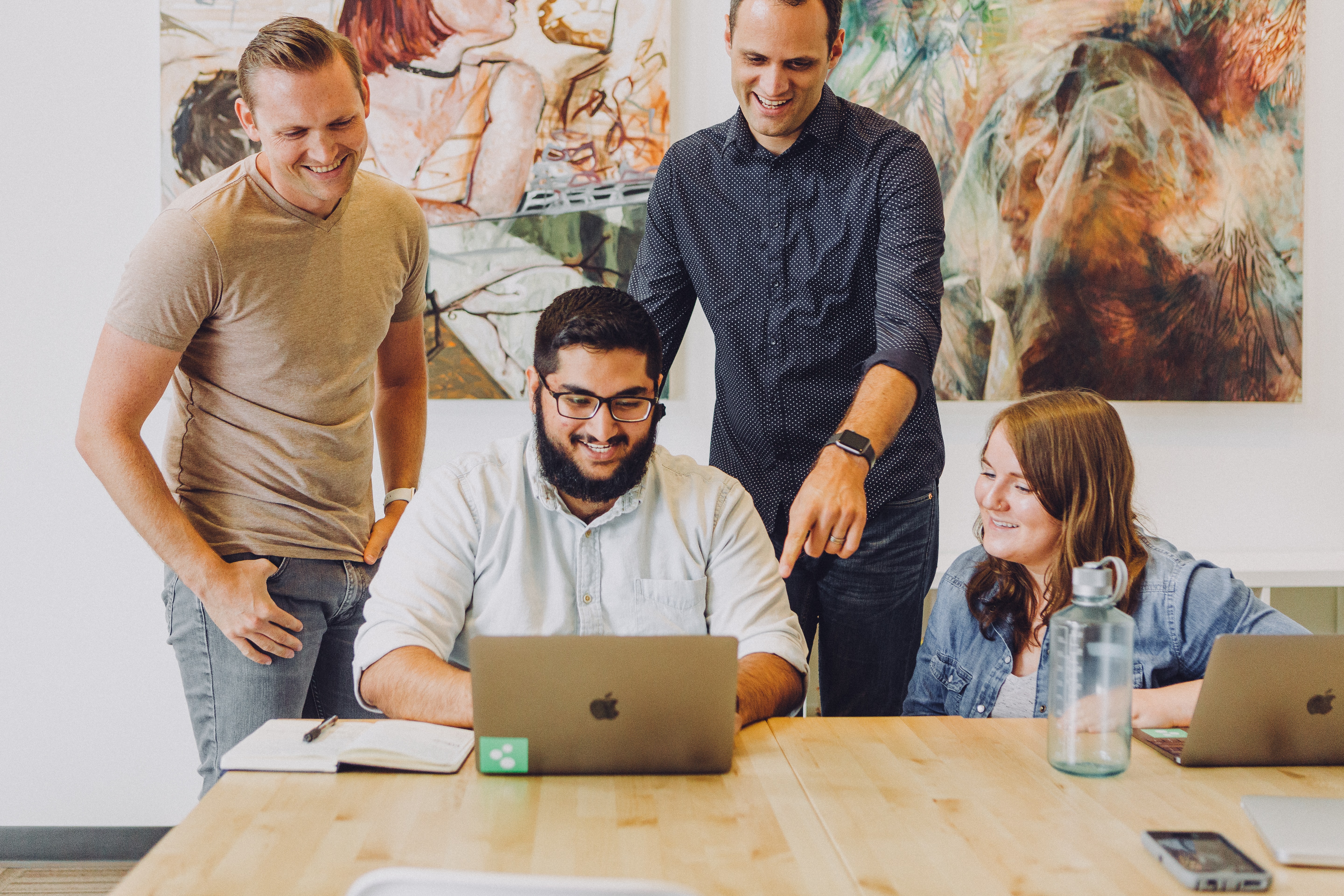 Employees looking at computer screen